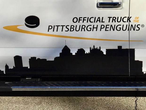 Pittsburgh skyline on side of Ford truck with the message "the Official Truck of the Pittsburgh Penguins"