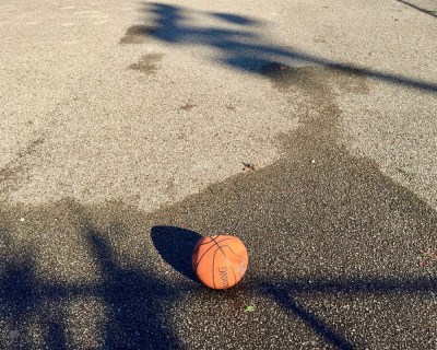 flat basketball on empty macadam
