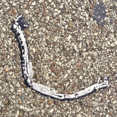 aluminum flashing embedded in road tar