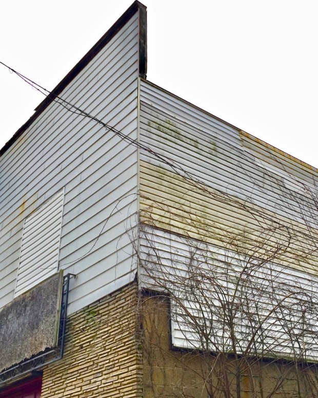 small building with multiple siding materials in Donora, PA