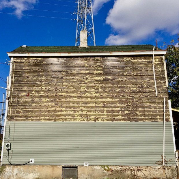 small building with multiple siding materials in Pittsburgh, PA