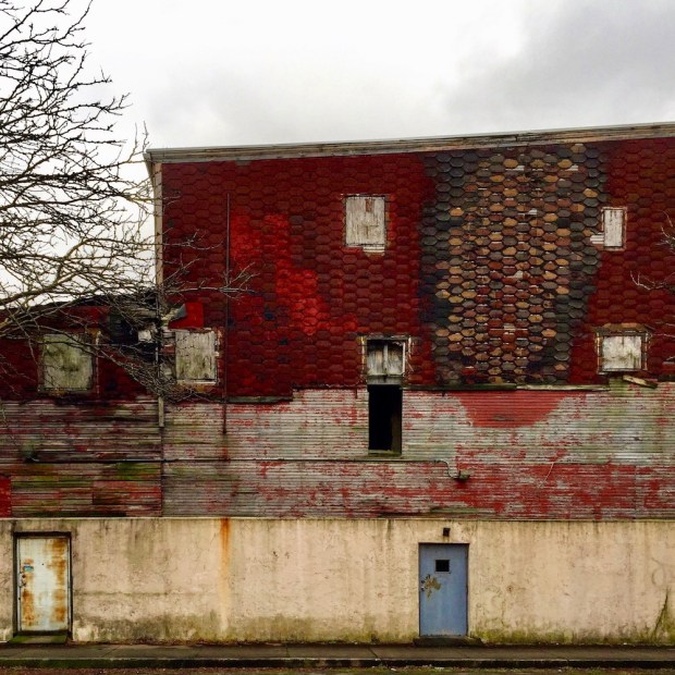 house wall showing multiple siding materials