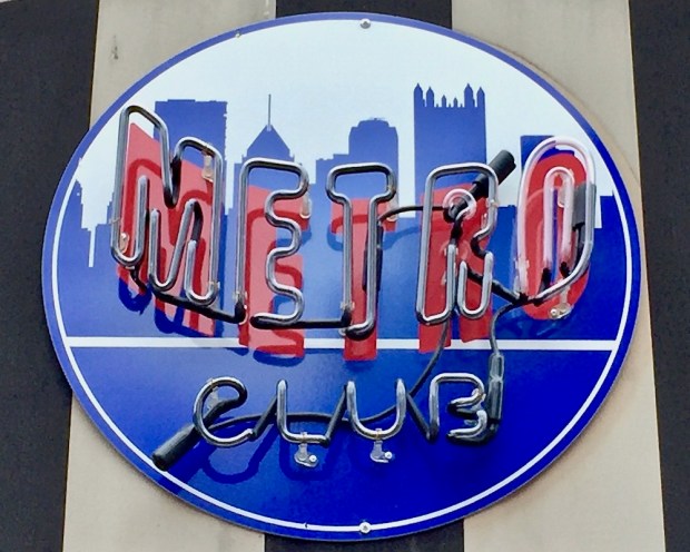logo for Metro Club featuring silhouetted buildings from the Pittsburgh skyline