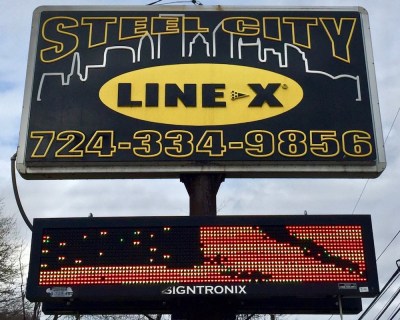 sign for Steel City Line-X including the Pittsburgh skyline
