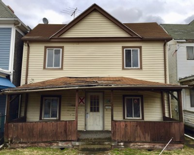 wood frame house marked with red "X" for demolition, New Kensington, PA