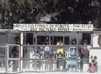 front window of DeVon Smith's home in Wampum, PA with six robot sculptures on display