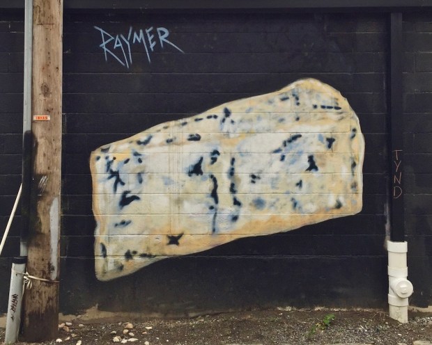 mural of block of blue cheese painted by artist Jeremy Raymer