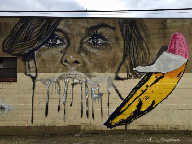 mural of Andy Warhol and peeled pink banana by artist Jeremy Raymer