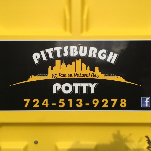 logo for Pittsburgh Potty including the downtown Pittsburgh skyline and slogan "We run on natural gas"