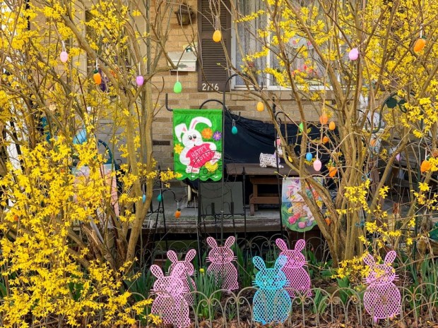house with yellow flowers and Easter decorations