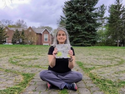 Lisa Valentino with crossed-off map of Pittsburgh streets