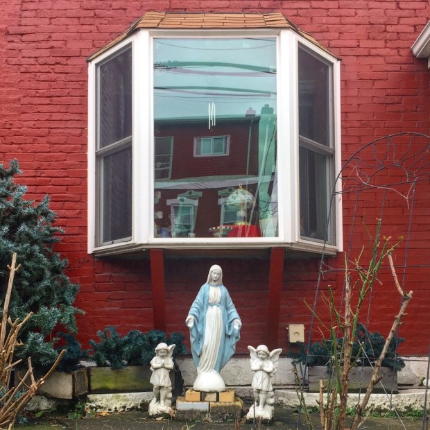 statues of Mary and angels in front yard