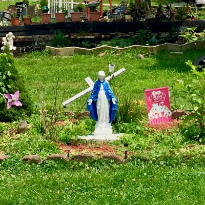 statue of Mary in large garden bed