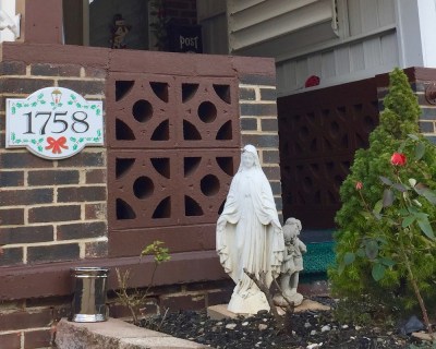 house with statue of Mary