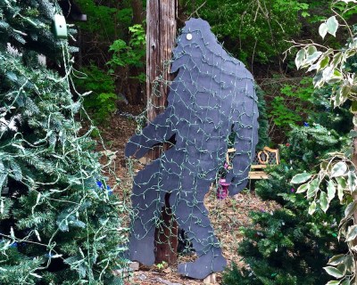 cut-out Big Foot figure wrapped in Christmas lights