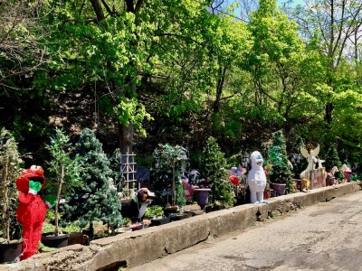 small parklet decorated with Christmas trees and lawn decorations
