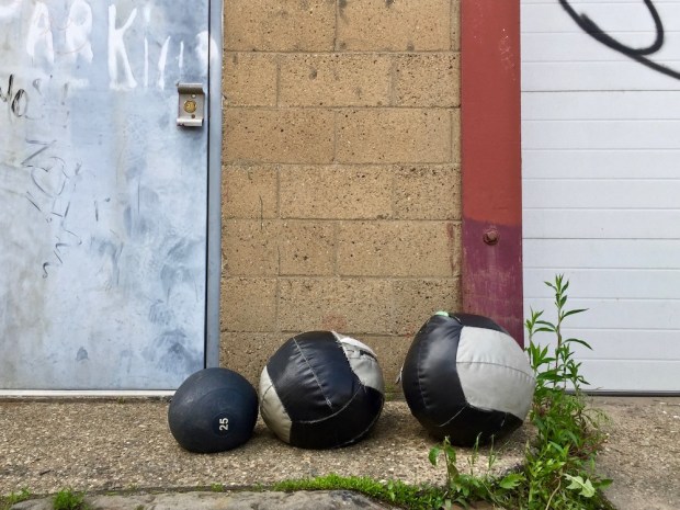 worn medicine balls left in alley