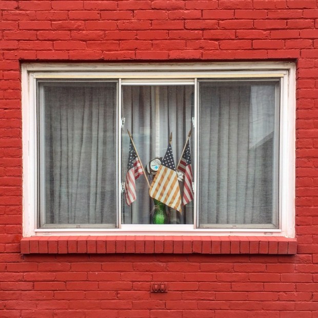 window with American flags