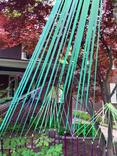 house front yard decorated with colored streamers