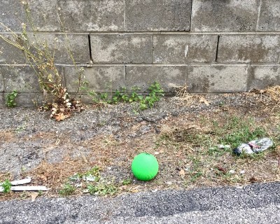 green ball left in alley