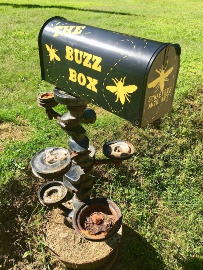 mailbox painted with insects and the words "The Buzz Box"
