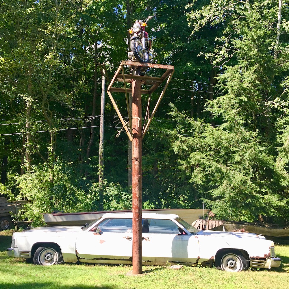two 1970s Lincoln Continental front ends joined together to make a single art car