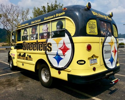old school bus decorated in celebration of the Pittsburgh Steelers