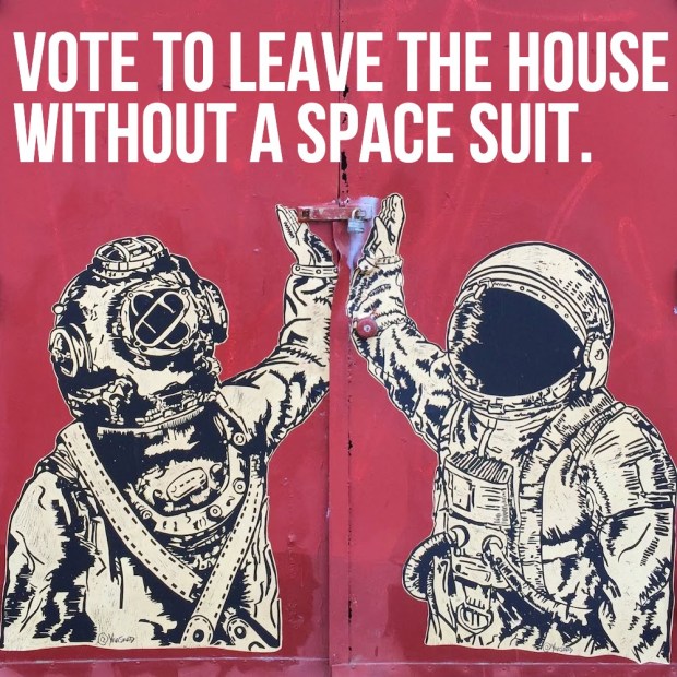 wheatpaste images of person in diving bell high-fiving person in space suit
