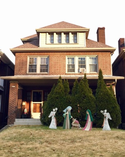 Christmas nativity scene with plastic Mary, Joseph, and baby Jesus decorations outside home