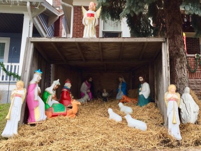 Christmas nativity scene with plastic Mary, Joseph, and baby Jesus decorations outside home