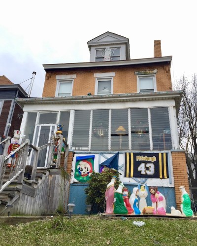 Christmas nativity scene with plastic Mary, Joseph, and baby Jesus decorations outside home