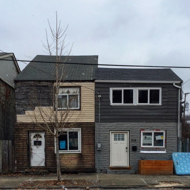 pair of row houses with very different siding treatments, Pittsburgh, PA