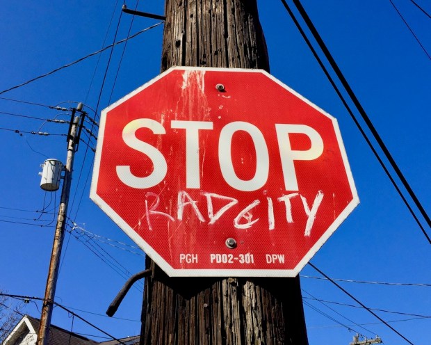 stop sign altered to read "Stop Rad City"