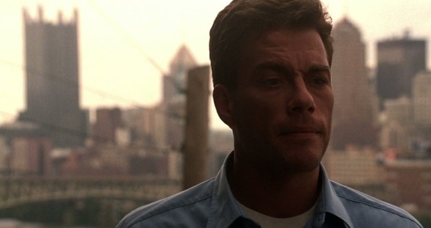 scene from "Sudden Death" with actor Jean-Claude Van Damme against the Pittsburgh city skyline