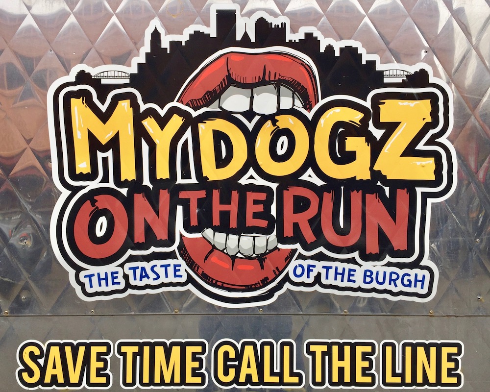 signage for My Dogz on the Run food truck including silhouette of Pittsburgh skyline