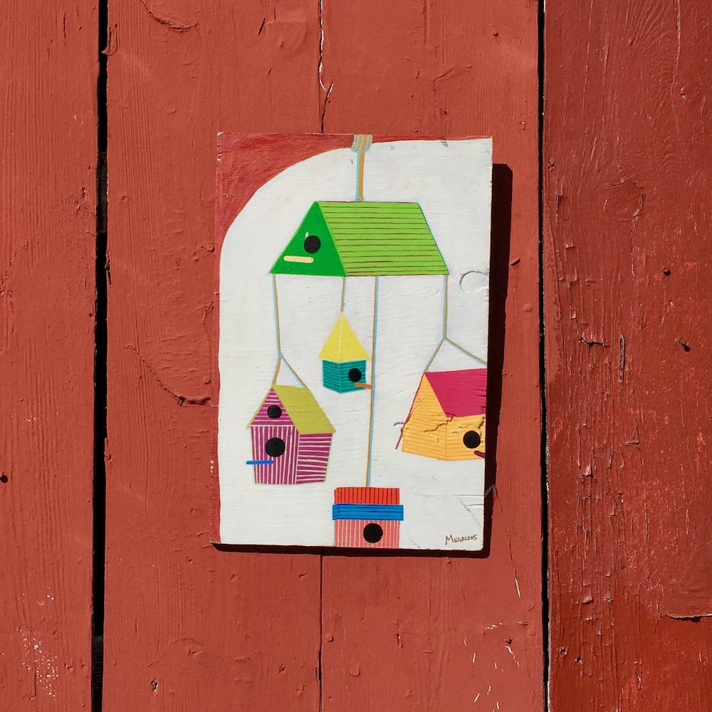 painting of birdhouses hung on exterior fence