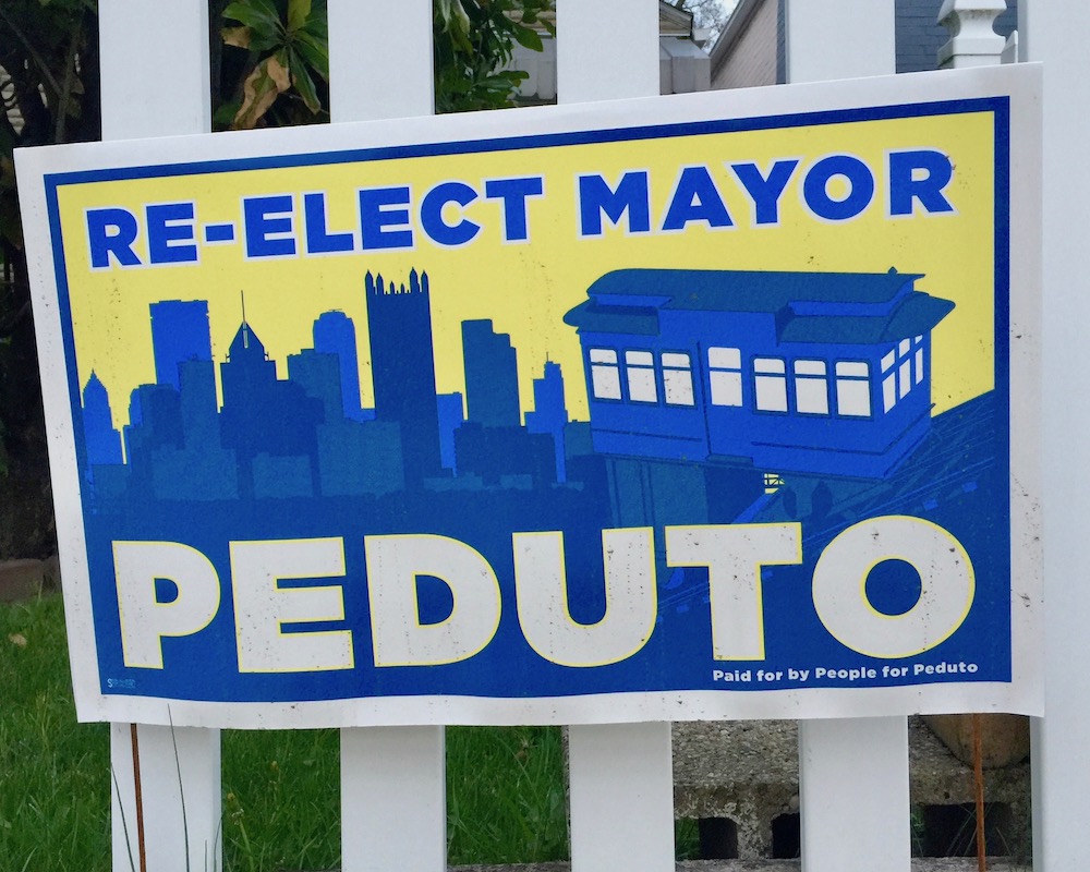 yard sign for Bill Peduto as Pittsburgh city mayor including the downtown Pittsburgh skyline