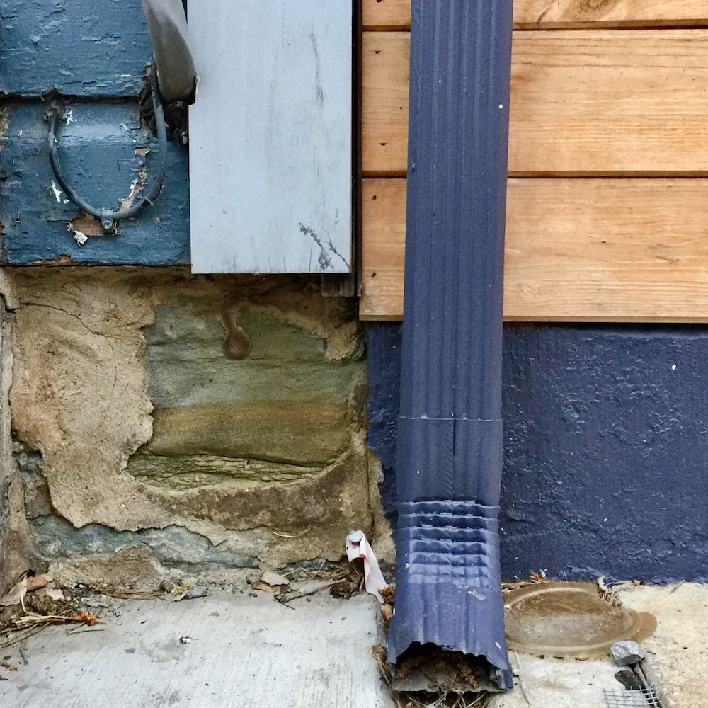 detail of row houses where paint colors make four perfect squares