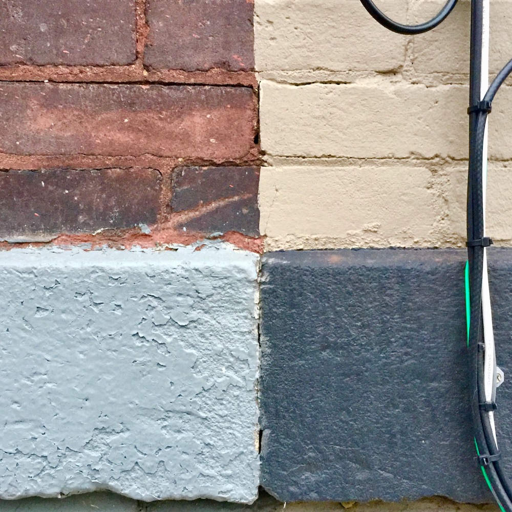 detail of row houses where paint colors make four perfect squares