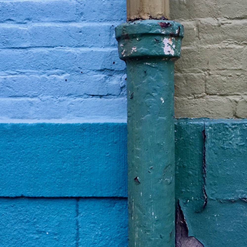 detail of row houses where paint colors make four perfect squares