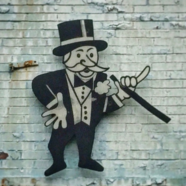 logo for Transmission Magician of cartoon man in top hat, black suit, and magic wand