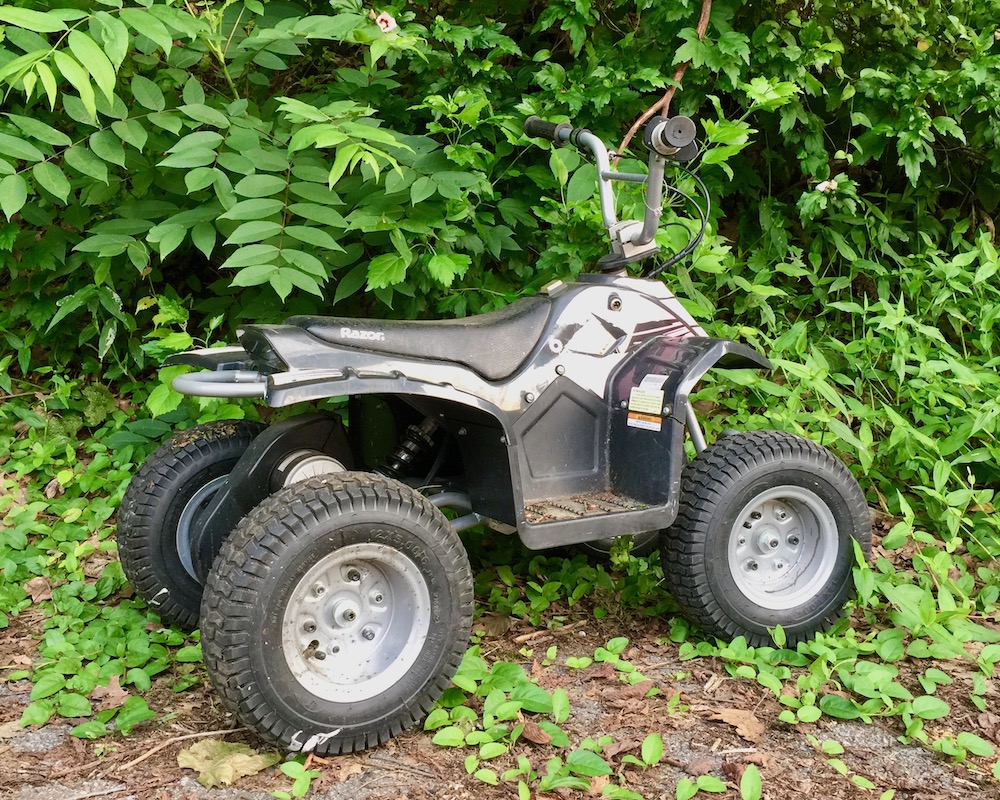 child's all-terrain vehicle left on roadside