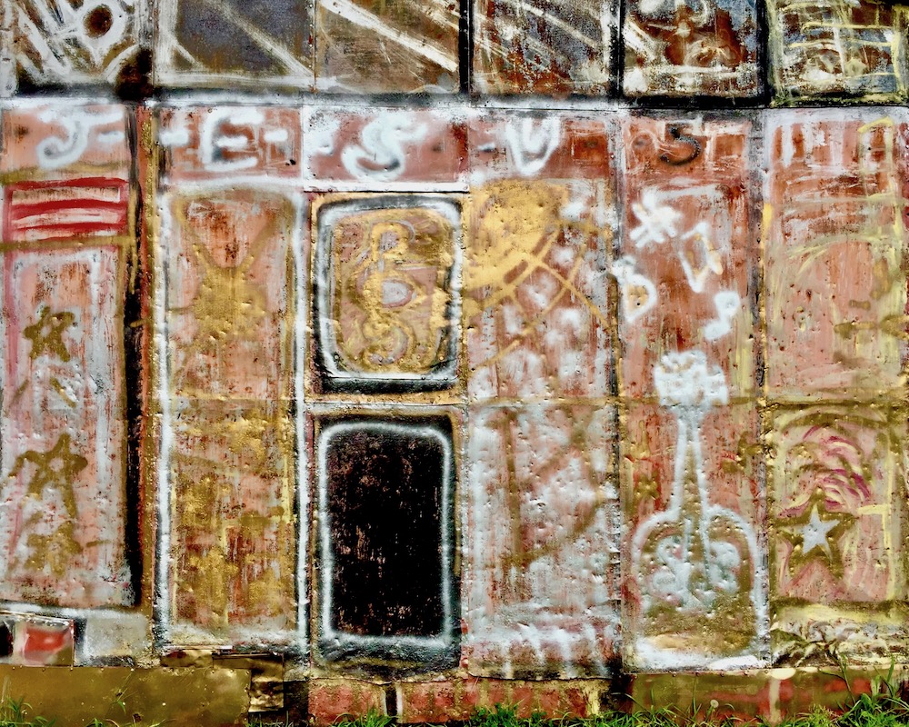 colorful abstract designs painted on metal shed panels