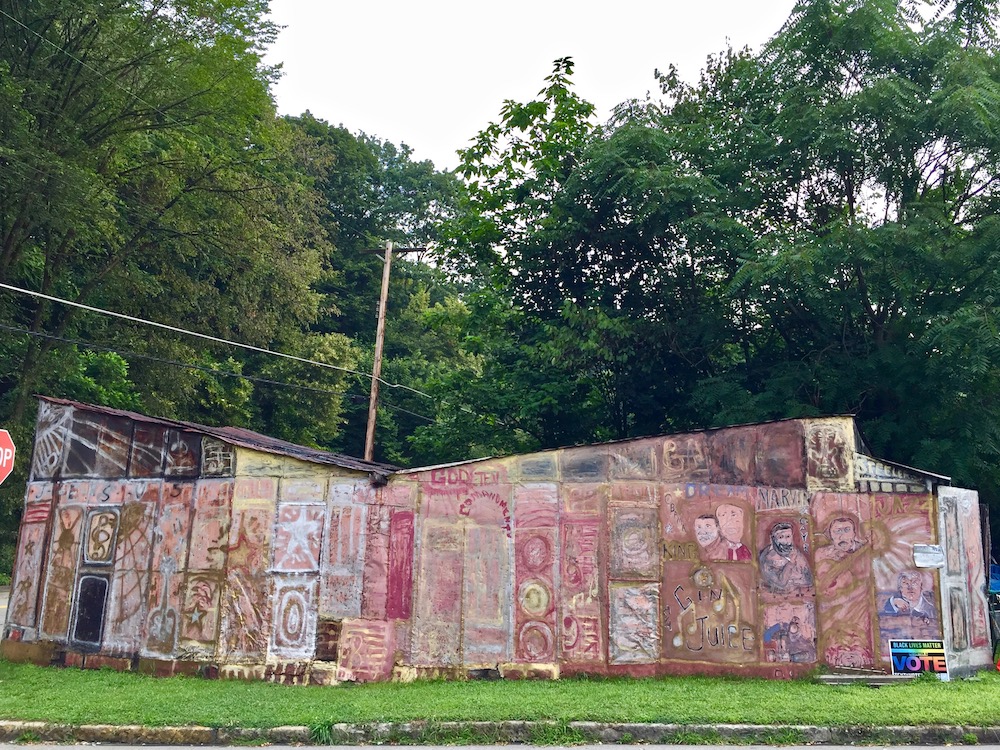 large metal shed painted in elaborate abstract panels