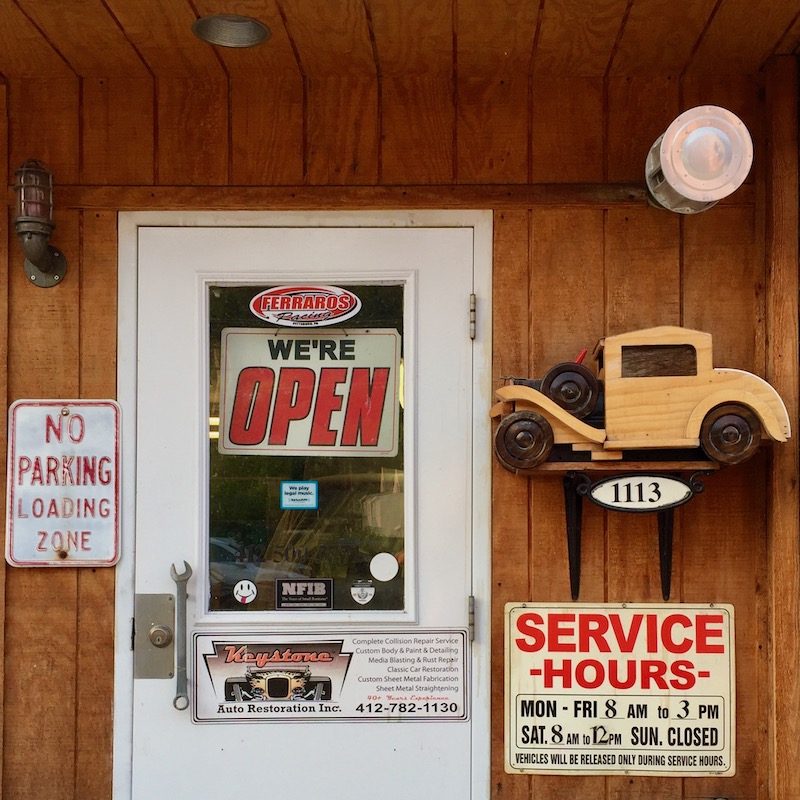 entrance to mechanic shop including wooden model car