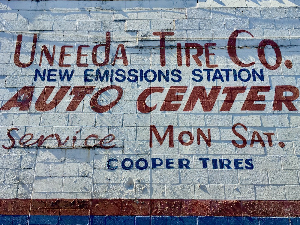 hand-painted sign for Uneeda Tire Co., Beaver Falls, PA