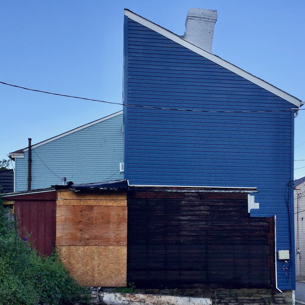 side-view of row house exterior made up of many different building materials