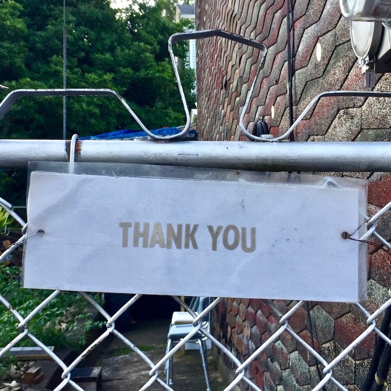 note attached to gate reading "Thank you"
