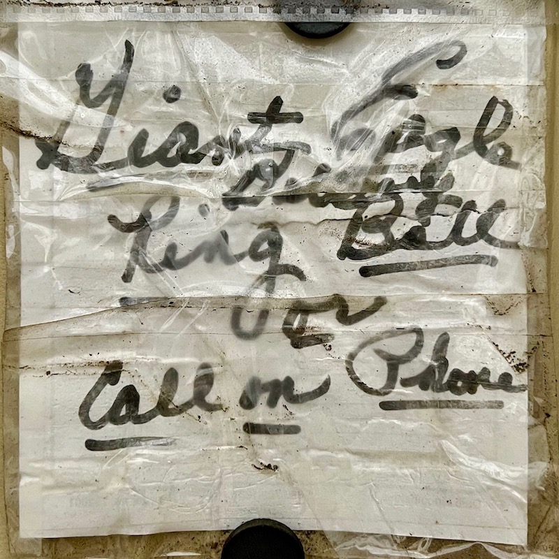 instuctions for mail and package delivery taped to front door of residence