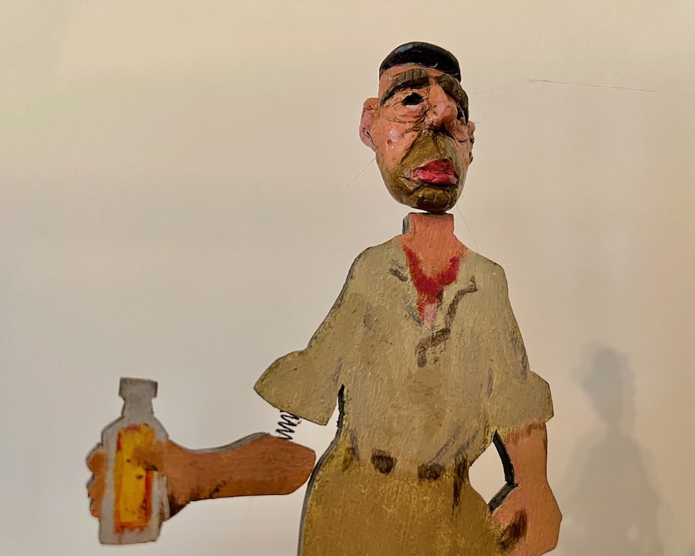 wooden sculpture of Humphrey Bogart in the movie "African Queen"